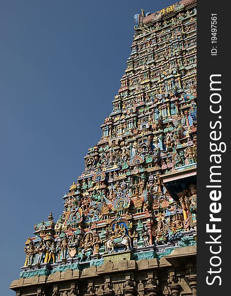 Meenakshi hindu temple in Madurai, Tamil Nadu, South India. Sculptures on Hindu temple gopura (tower). It is a twin temple, one of which is dedicated to Meenakshi, and the other to Lord Sundareswarar