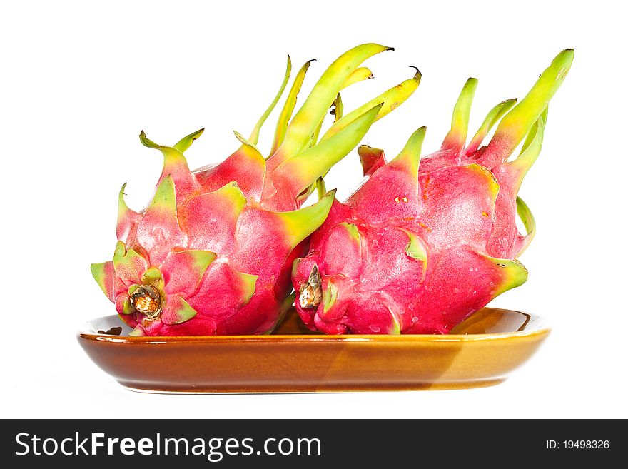 Dragon fruit On the dish on white. Dragon fruit On the dish on white