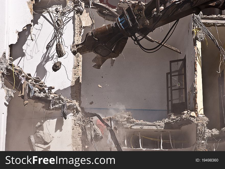 Indrustrial Machine Demolishing A Building