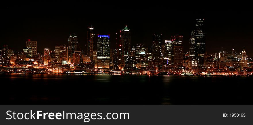 Nighttime view of Seattle's downtown and harbor. Nighttime view of Seattle's downtown and harbor