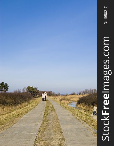 Two women walking in the distance along a concrete slabs road at the sea. Clear blue sky, copy space.

<a href='http://www.dreamstime.com/baltic-sea-scenics.-seaside-towns-and-villages-as-well.-rcollection3976-resi208938' STYLE='font-size:13px; text-decoration: blink; color:#FF0000'><b>MORE BALTIC PHOTOS »</b></a>. Two women walking in the distance along a concrete slabs road at the sea. Clear blue sky, copy space.

<a href='http://www.dreamstime.com/baltic-sea-scenics.-seaside-towns-and-villages-as-well.-rcollection3976-resi208938' STYLE='font-size:13px; text-decoration: blink; color:#FF0000'><b>MORE BALTIC PHOTOS »</b></a>