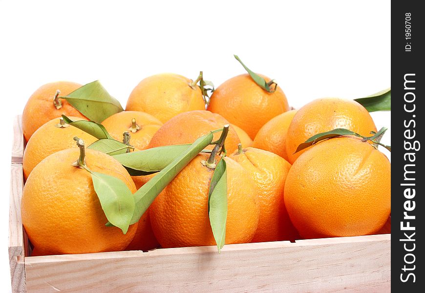Oranges on old wooden box in a fruitshop