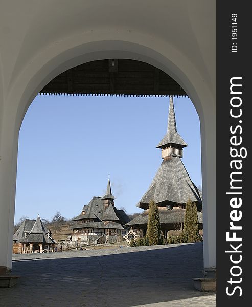 The entrance in the wooden monastery framed picture