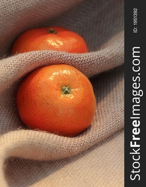 Juicy fresh clementines on hessian sack