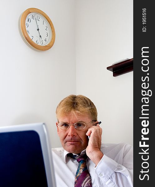 A businessman attending to an important call.