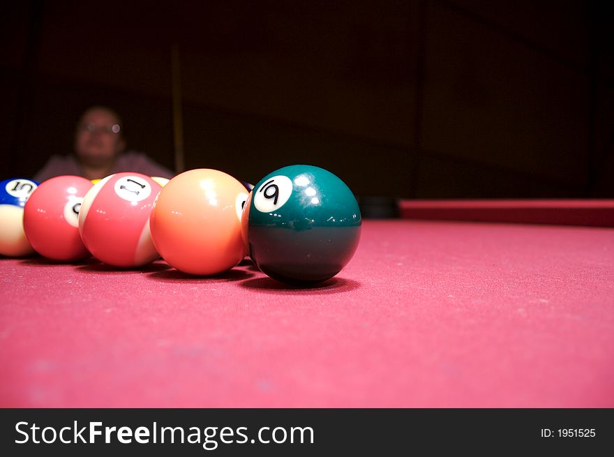 Woman near billiard table with colour balls on it. Woman near billiard table with colour balls on it