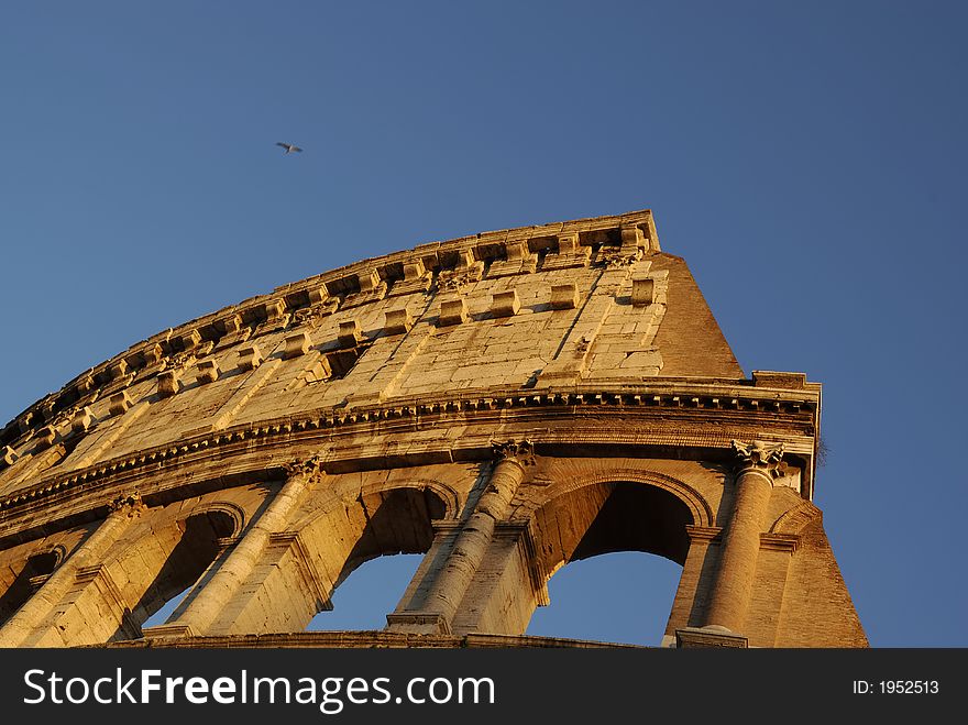 The coliseum in Rome, Italy, painted by a beautiful warm setting sun light