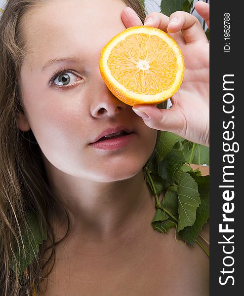 Beautiful young woman portrait with orange. Beautiful young woman portrait with orange