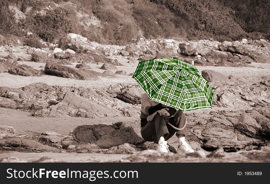 A women hiding under the umbrella