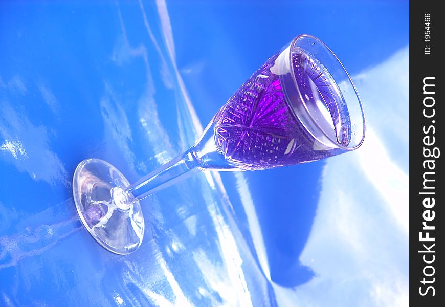 Tall glass with blue drink on white background. Tall glass with blue drink on white background