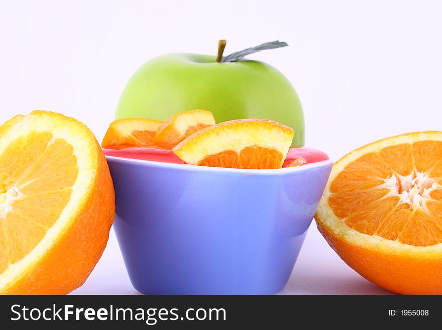 Orange Jelly in a white bowl with silverware. Orange Jelly in a white bowl with silverware.