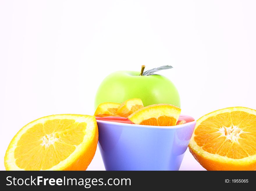 Orange Jelly in a white bowl with silverware. Orange Jelly in a white bowl with silverware.