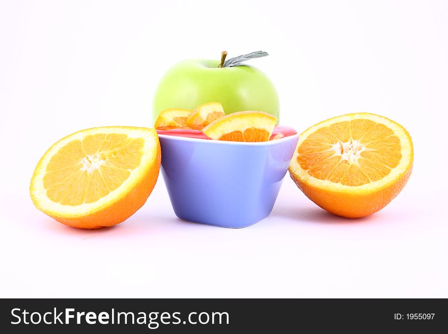 Orange Jelly in a white bowl with silverware. Orange Jelly in a white bowl with silverware.