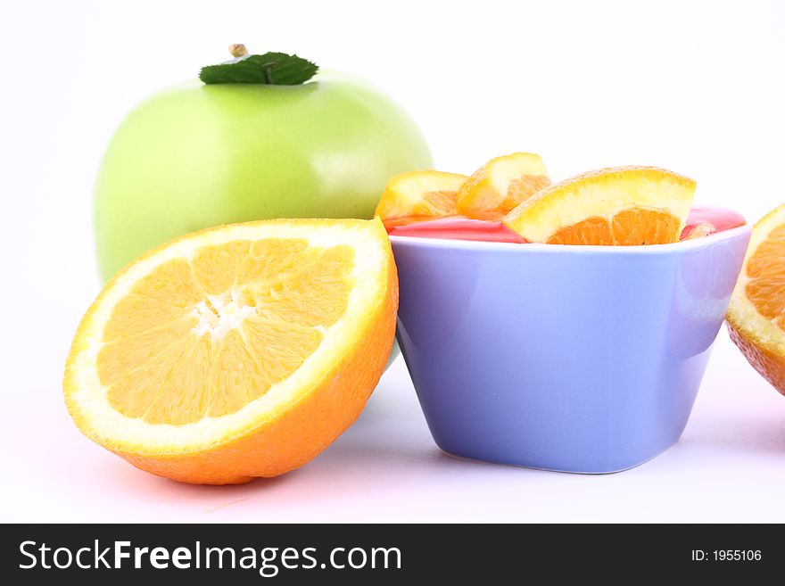 Orange Jelly in a white bowl with silverware. Orange Jelly in a white bowl with silverware.