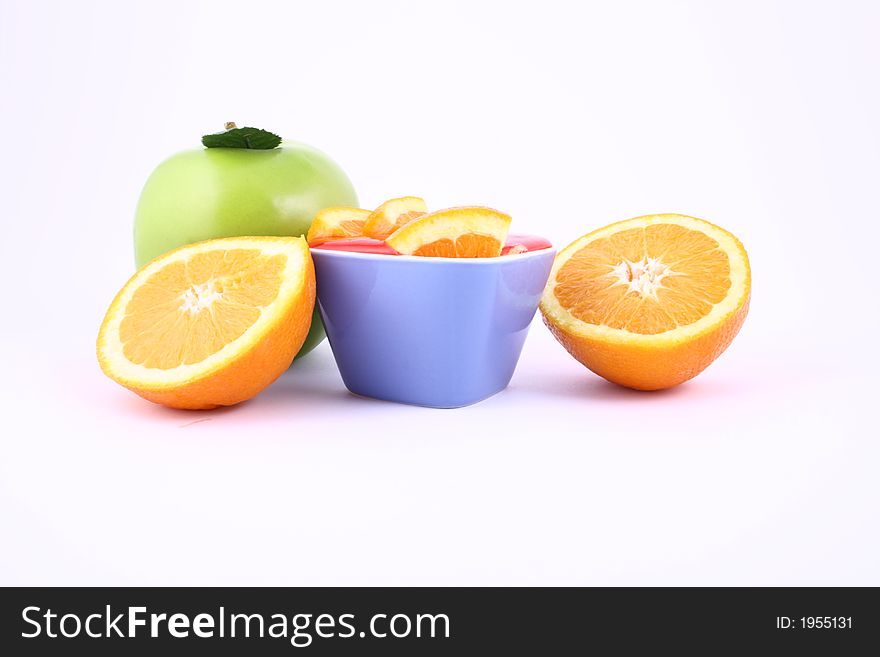 Orange Jelly in a white bowl with silverware. Orange Jelly in a white bowl with silverware.