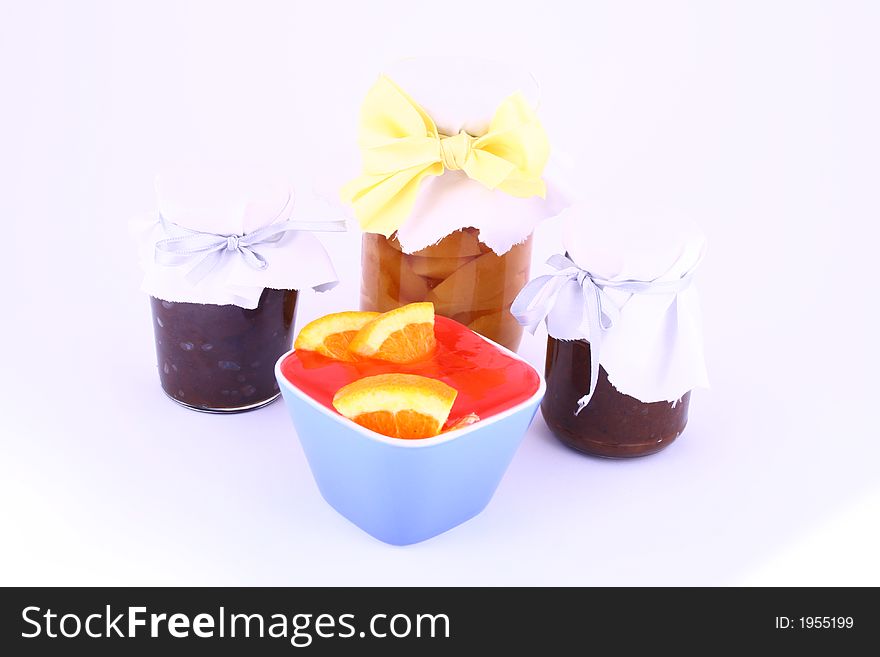 A closed glass of raspberry jam against white. File contains clipping path. A closed glass of raspberry jam against white. File contains clipping path.