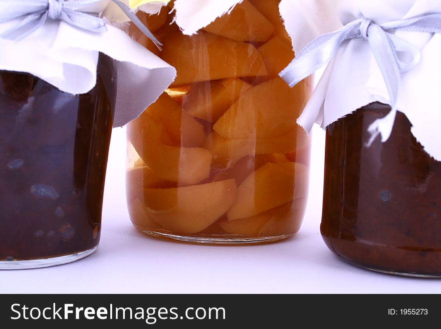 A closed glass of raspberry jam against white. File contains clipping path. A closed glass of raspberry jam against white. File contains clipping path.