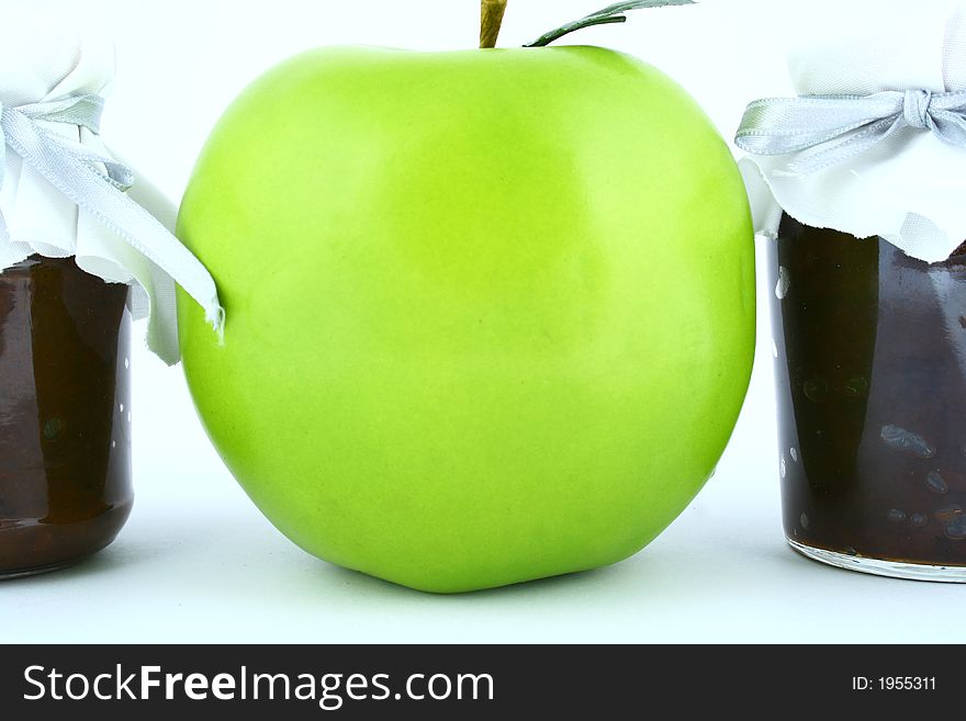 A closed glass of raspberry jam against white. File contains clipping path. A closed glass of raspberry jam against white. File contains clipping path.