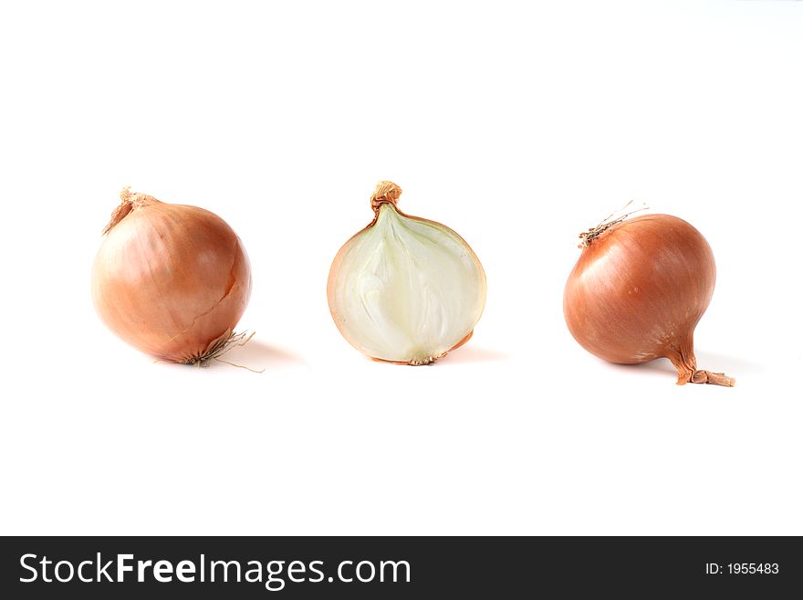 Two onions and a half on white background. Two onions and a half on white background.