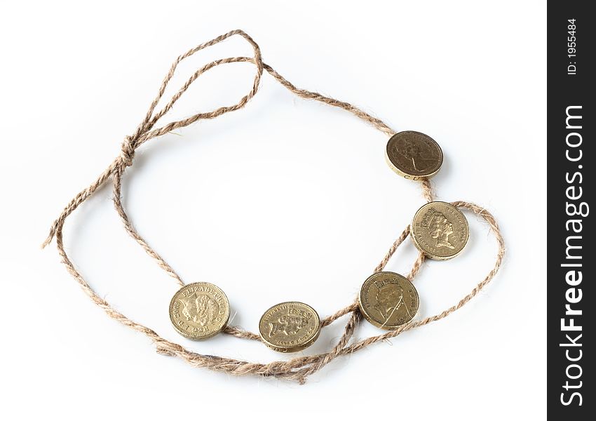 Five one pound british coins on the rope
