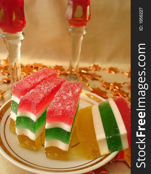 Celebratory Table (Color Jelly Cake On Plate And Two Red Glasses