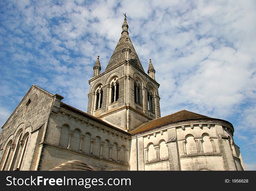 Historic church in France against a mackerel sky