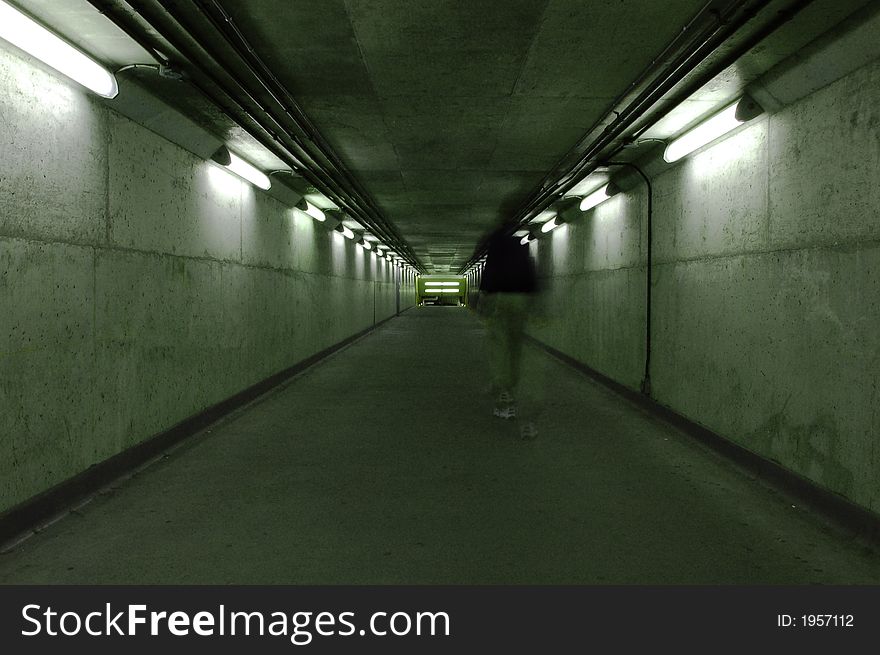 A ghostly figure walking down a dark hallway