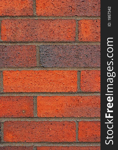 Facade of a red brick and mortar wall. Facade of a red brick and mortar wall.