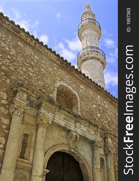 The last minaret in Crete, vestige of ottoman era is in Rethymnon. In the base the old mosque has been changed for a church of corinthian style. The last minaret in Crete, vestige of ottoman era is in Rethymnon. In the base the old mosque has been changed for a church of corinthian style.