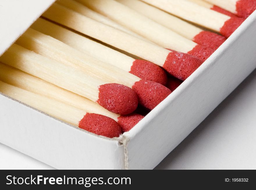 A box of red tipped matches in closeup