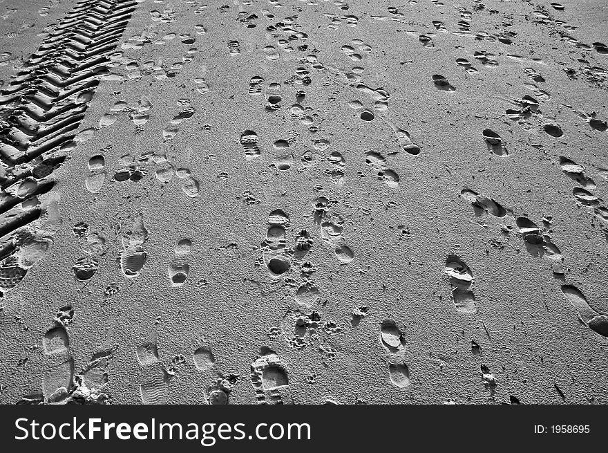 Foot Prints and car path In The Sand. Foot Prints and car path In The Sand