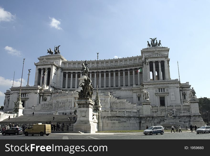 Tourists in front  of Victor Emmanuel II monument. also called Altare della Patria, fatherland's altar, a mausoleum, a tomb of an unknown soldier. Rome, Italy. Tourists in front  of Victor Emmanuel II monument. also called Altare della Patria, fatherland's altar, a mausoleum, a tomb of an unknown soldier. Rome, Italy