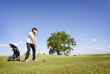 Woman Focusing On Golf Fairway. Stock Image