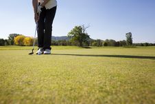 Female Golf Player Putting Ball. Royalty Free Stock Photos Female Golf Player Putting Ball. Royalty Free Stock Photos