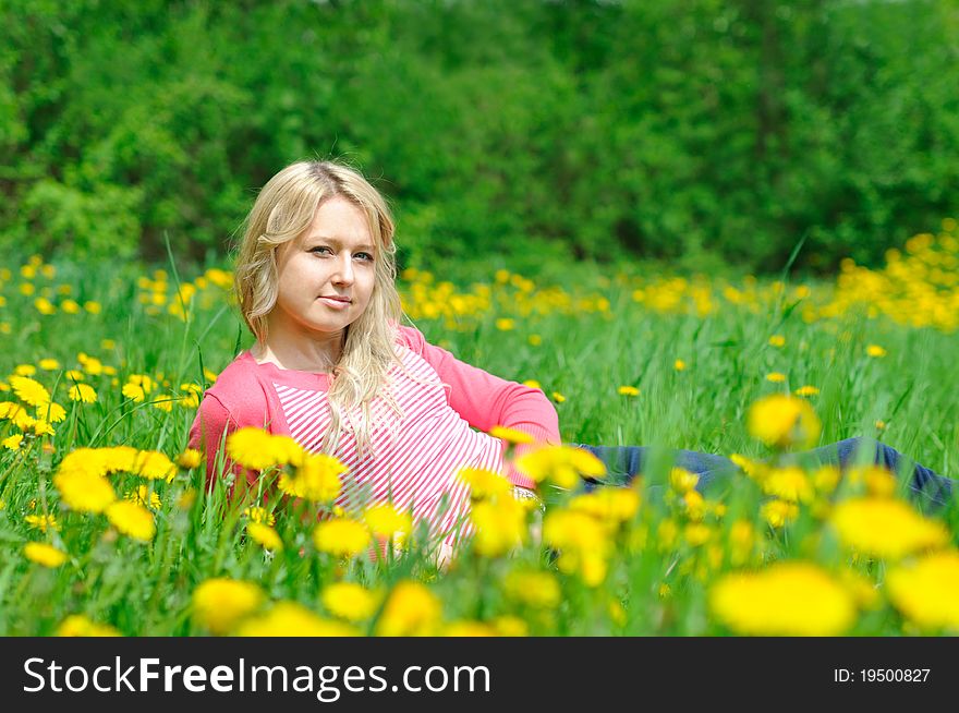 Young pretty woman on the green grass. Young pretty woman on the green grass