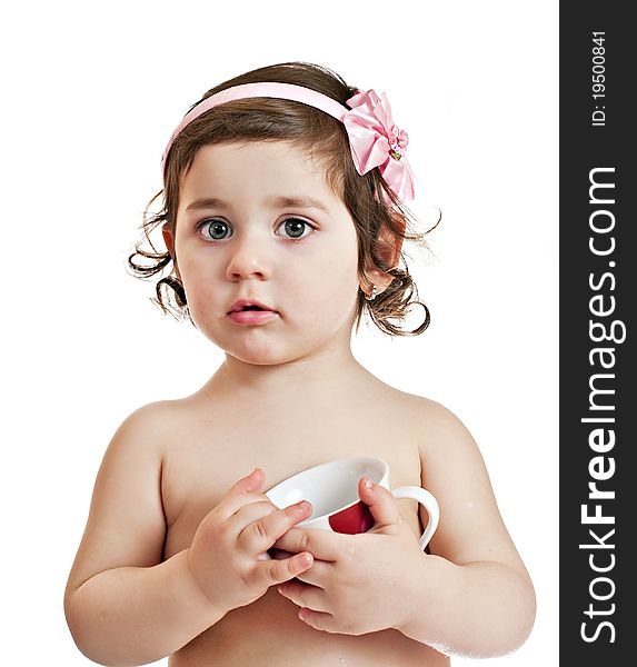 Small beautiful baby girl with cup