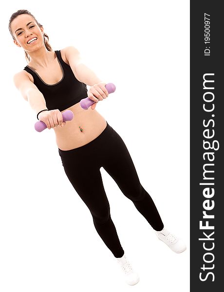 A young female dressed in black gym clothes performing an exercise with hand weights on isloated white backround