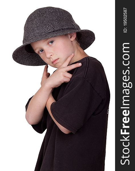 A photograph of a young boy with his arms crossed and holding a pease sign with his hands while wearing a grey hat. A photograph of a young boy with his arms crossed and holding a pease sign with his hands while wearing a grey hat.