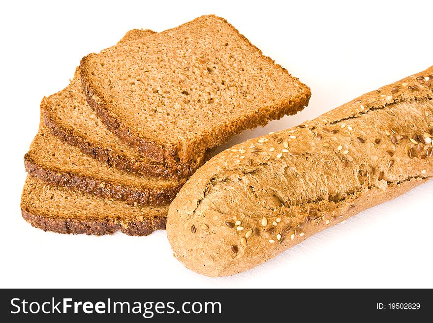 Slices of wholemeal bread and fitness baguette - healthy food isolated on white. Slices of wholemeal bread and fitness baguette - healthy food isolated on white