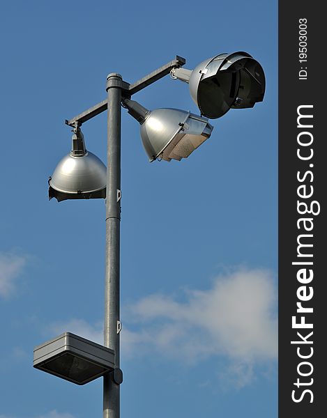 Road lamp against cloud sky