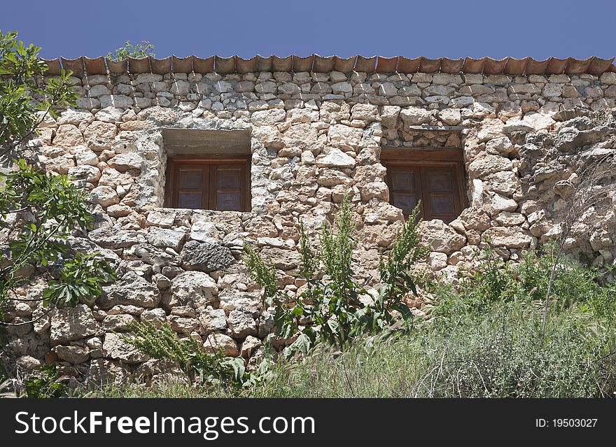 House built with stones in a village. House built with stones in a village