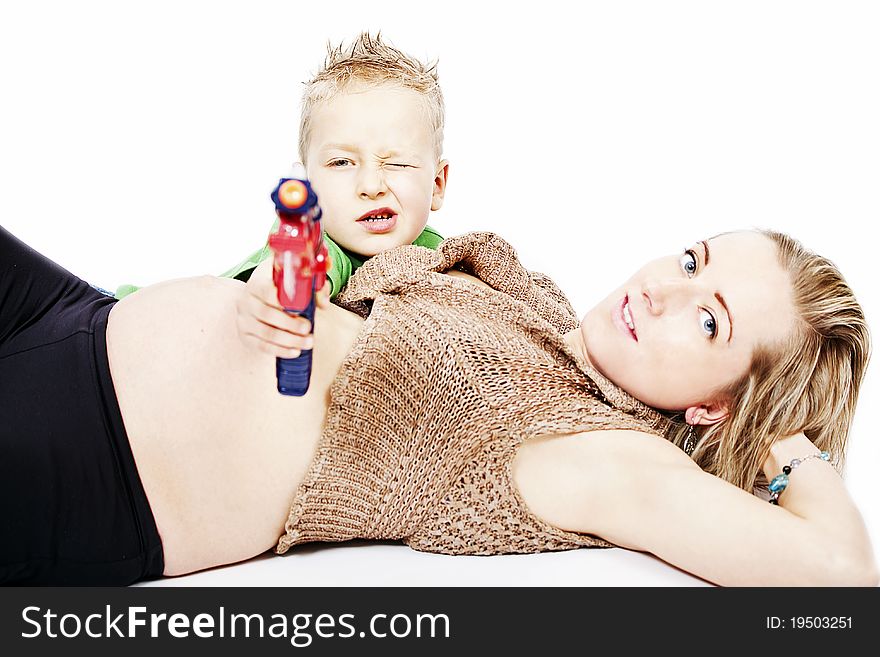 Pregnant mum and her son with toy gun. Pregnant mum and her son with toy gun