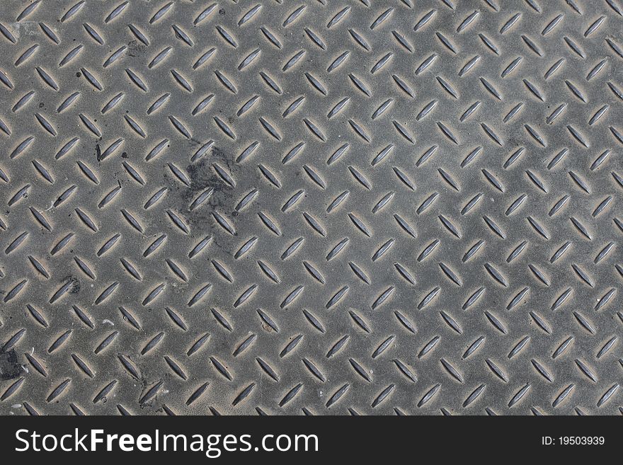 Grey steel surface's texture. Ideal to be a background.