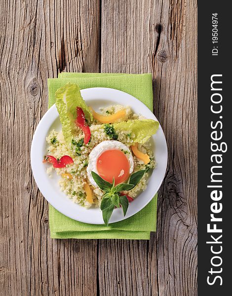 Vegetarian meal - Couscous salad and fried egg. Vegetarian meal - Couscous salad and fried egg