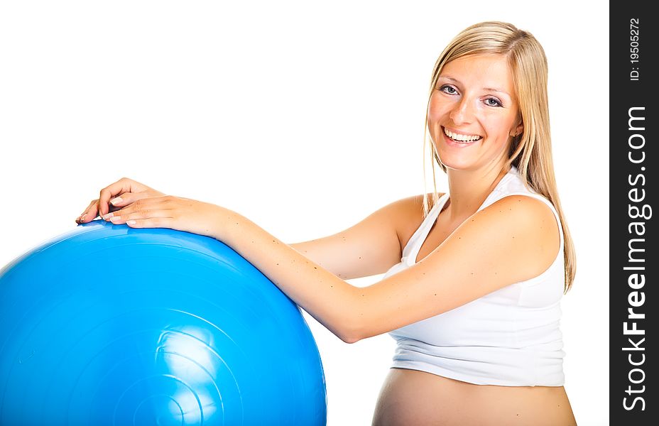 Pregnant woman excercises with gymnastic ball