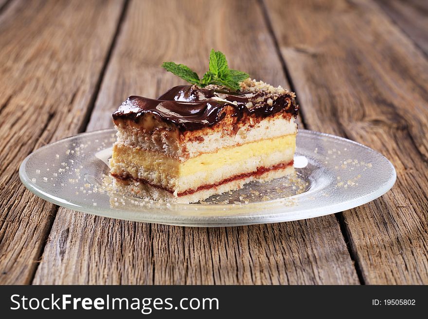 Slice of delicious cake with chocolate icing