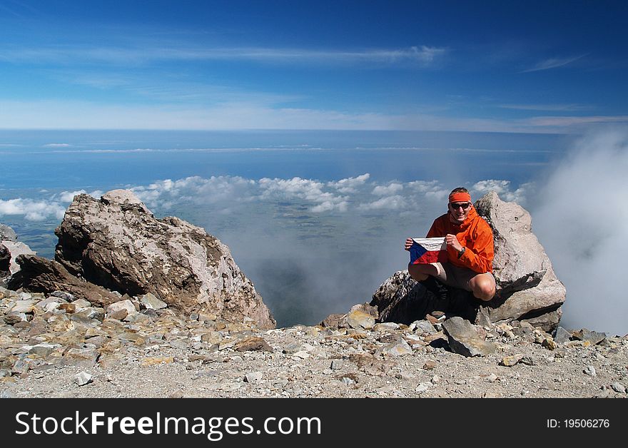 Hiker on Mount Taranaki summit, New Zealand. Hiker on Mount Taranaki summit, New Zealand