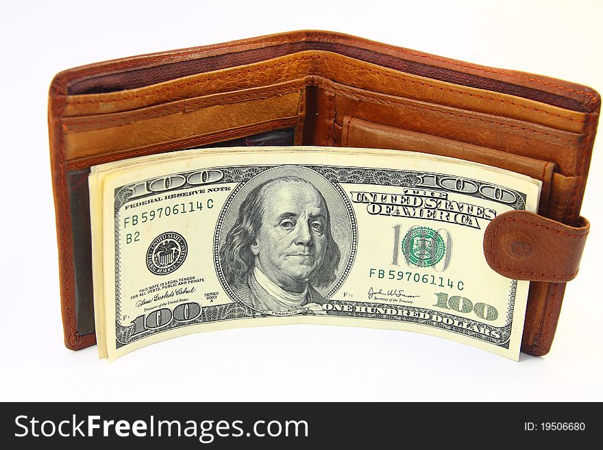 Wallet with dollars on white background