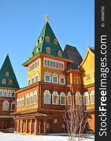 Wooden palace of Tsar Alexei Mikhailovich in Moscow in traditional Russian style at the background of a winter park. Wooden palace of Tsar Alexei Mikhailovich in Moscow in traditional Russian style at the background of a winter park.