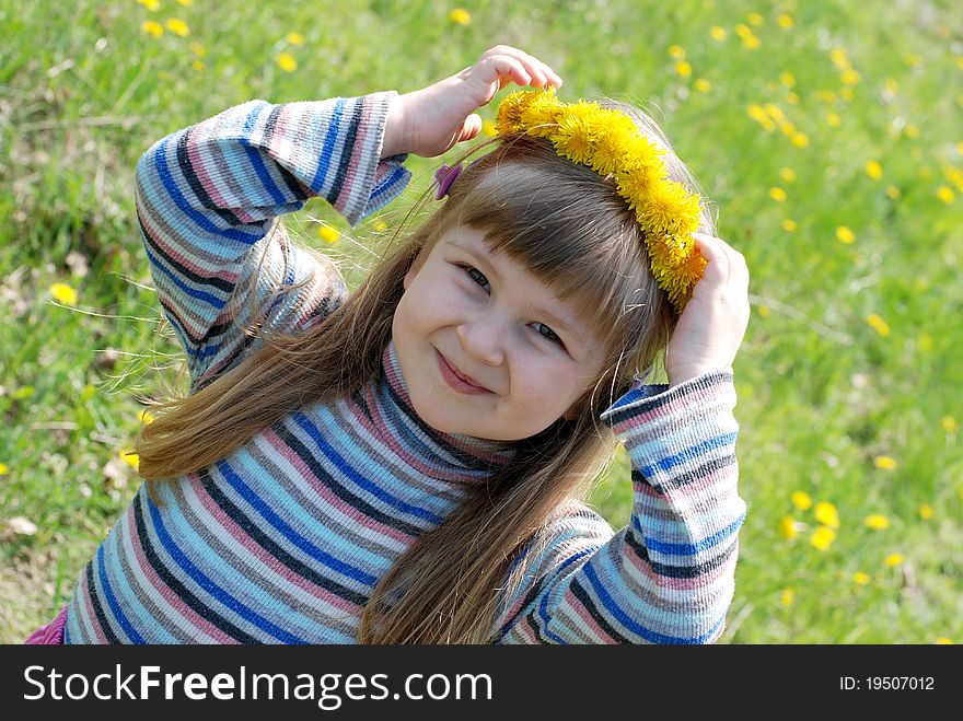 Spring sunny day. Little girl playing outdoors. Spring sunny day. Little girl playing outdoors